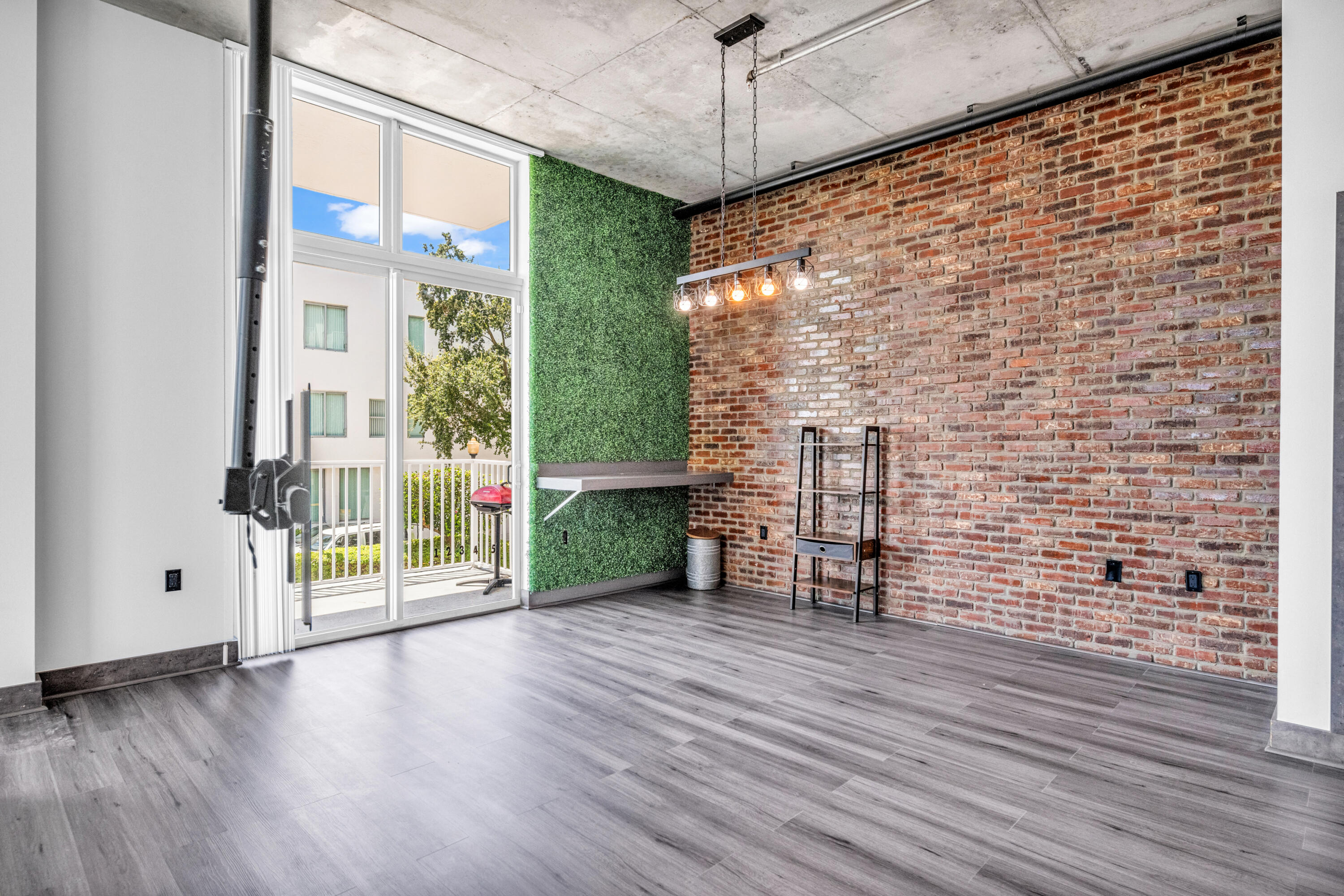 a view of an entryway with wooden floor