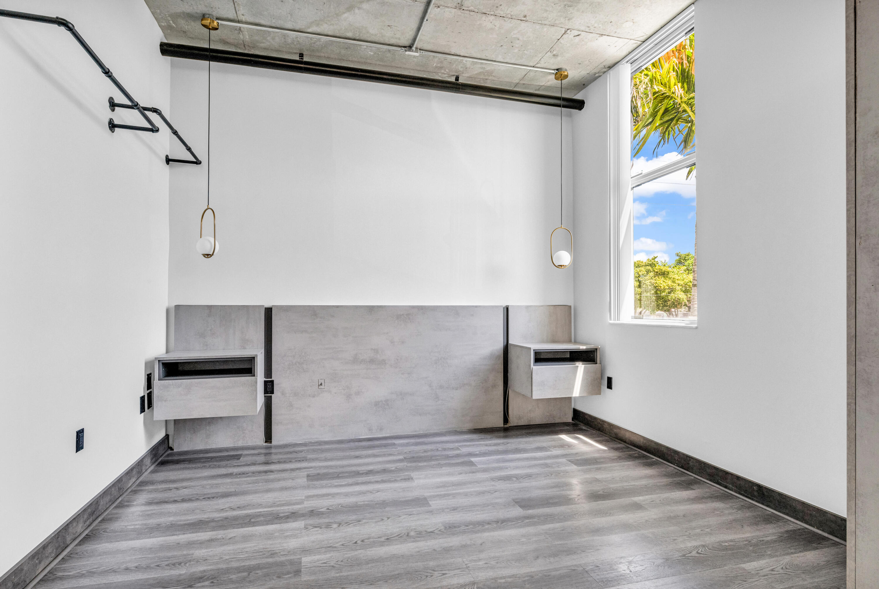 2100 Van Buren Street, Unit 203 Hollywood, FL 33020 - Photo 17 of 28 a view of an empty room with a window and wooden floor