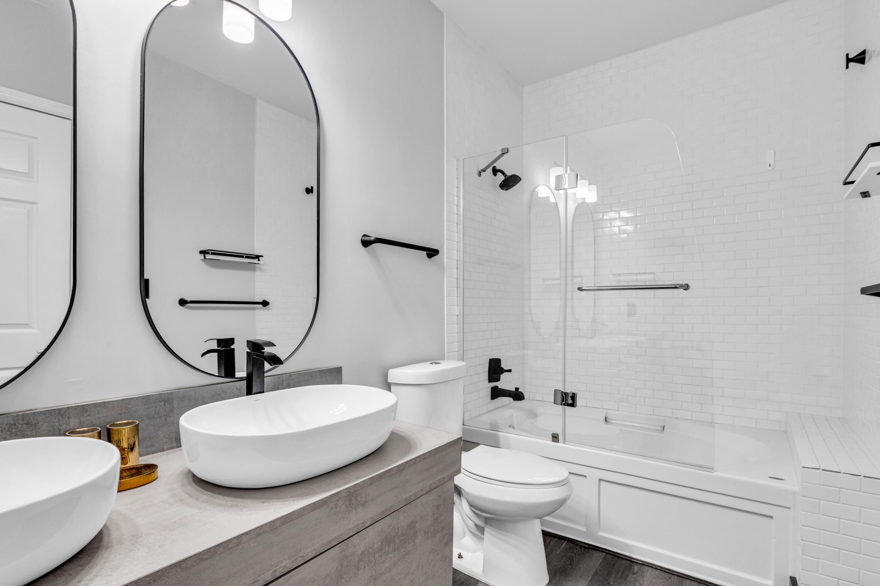 2100 Van Buren Street, Unit 203 Hollywood, FL 33020 - Photo 19 of 28 a bathroom with a toilet a sink and a mirror