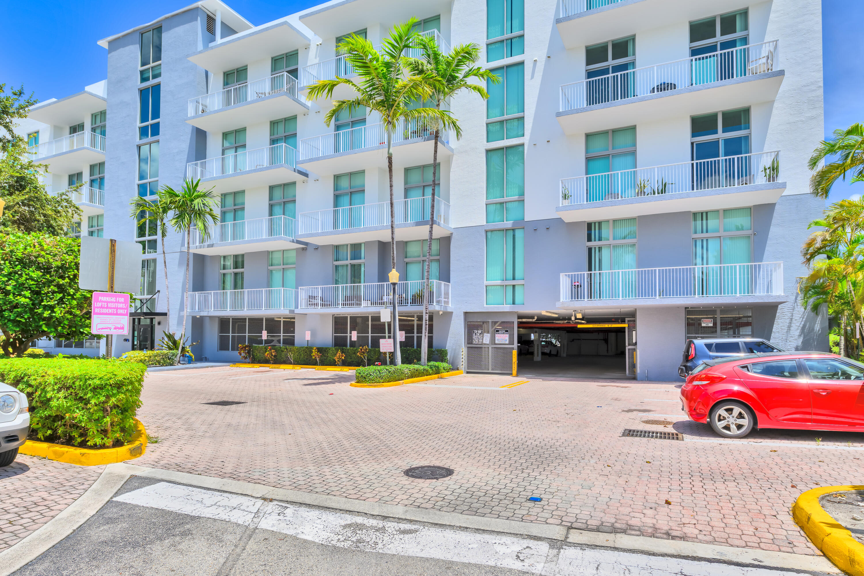 2100 Van Buren Street, Unit 203 Hollywood, FL 33020 - Photo 26 of 28 a car parked in front of a building