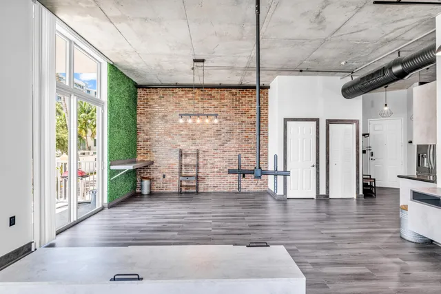 a view of an entryway with wooden floor and door