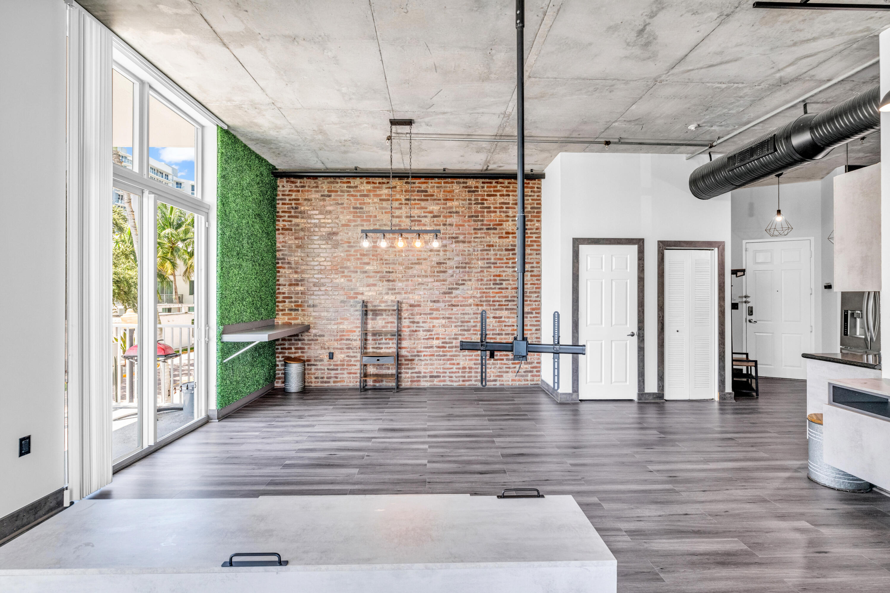 2100 Van Buren Street, Unit 203 Hollywood, FL 33020 - Photo 5 of 28 a view of an entryway with wooden floor and door