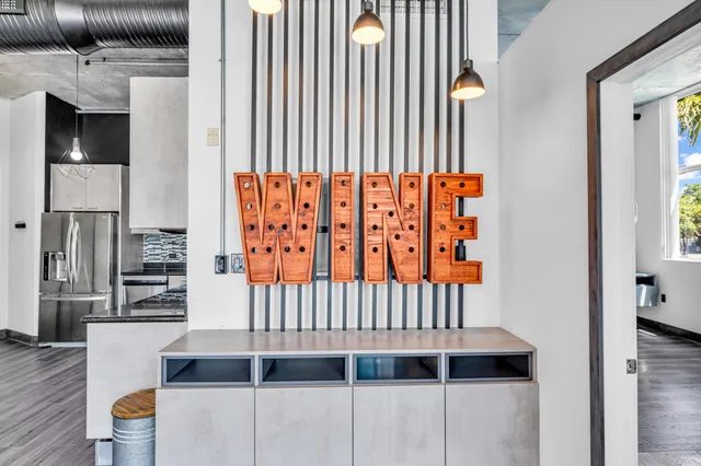 a view of a room with wooden floor and windows