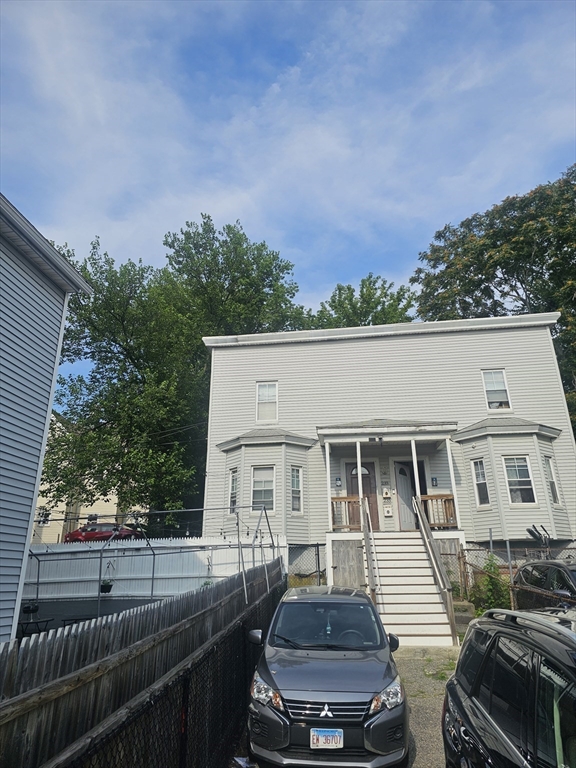 233-235 Main Street Everett, MA 02149 - Photo 1 of 20 a view of a yard in front of house