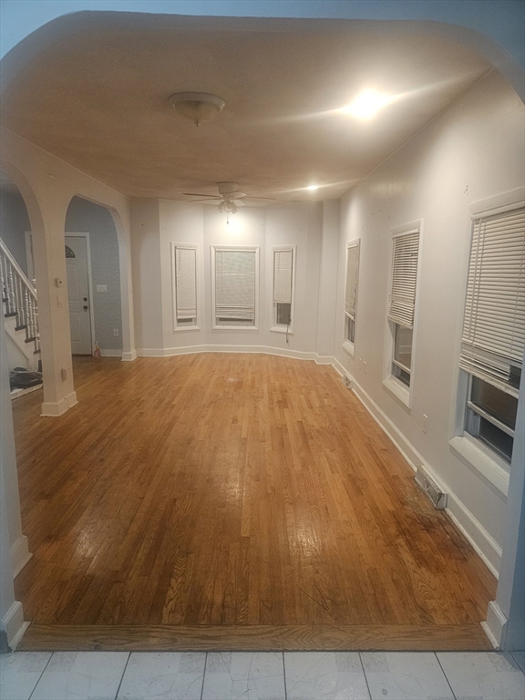 233-235 Main Street Everett, MA 02149 - Photo 12 of 20 an empty room with a fireplace