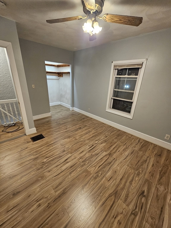 233-235 Main Street Everett, MA 02149 - Photo 16 of 20 a view of an empty room with wooden floor and a window