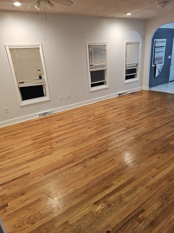 233-235 Main Street Everett, MA 02149 - Photo 9 of 20 a view of a livingroom with an empty space and wooden floor
