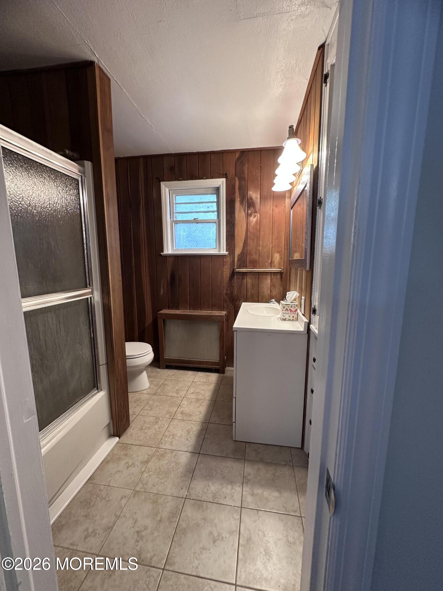 10 Ocean Street Highlands, NJ 07732 - Photo 11 of 15 a bathroom with a sink and a mirror