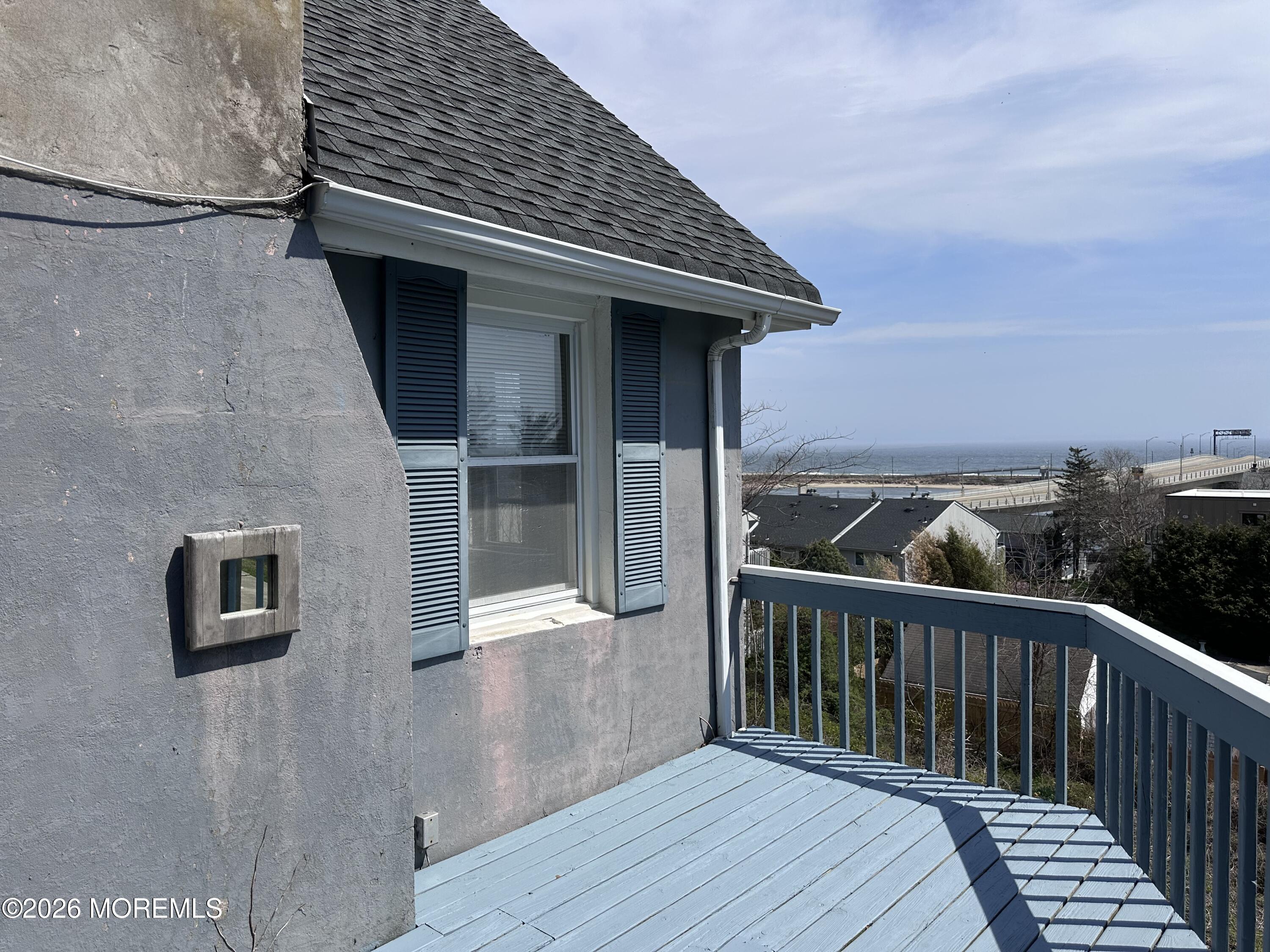 10 Ocean Street Highlands, NJ 07732 - Photo 12 of 15 a balcony of a house with wooden floor