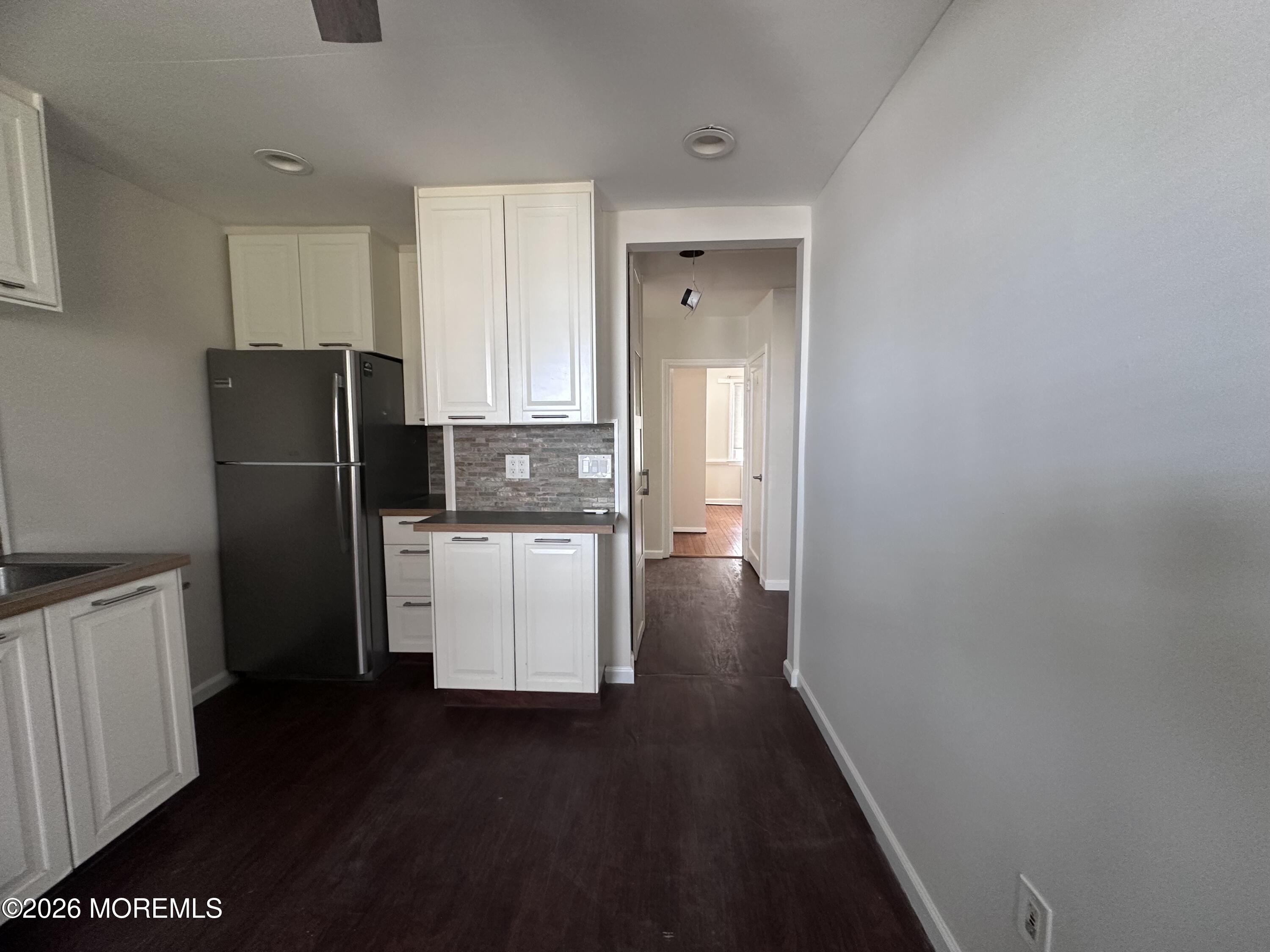 10 Ocean Street Highlands, NJ 07732 - Photo 7 of 15 a kitchen with a refrigerator and a sink
