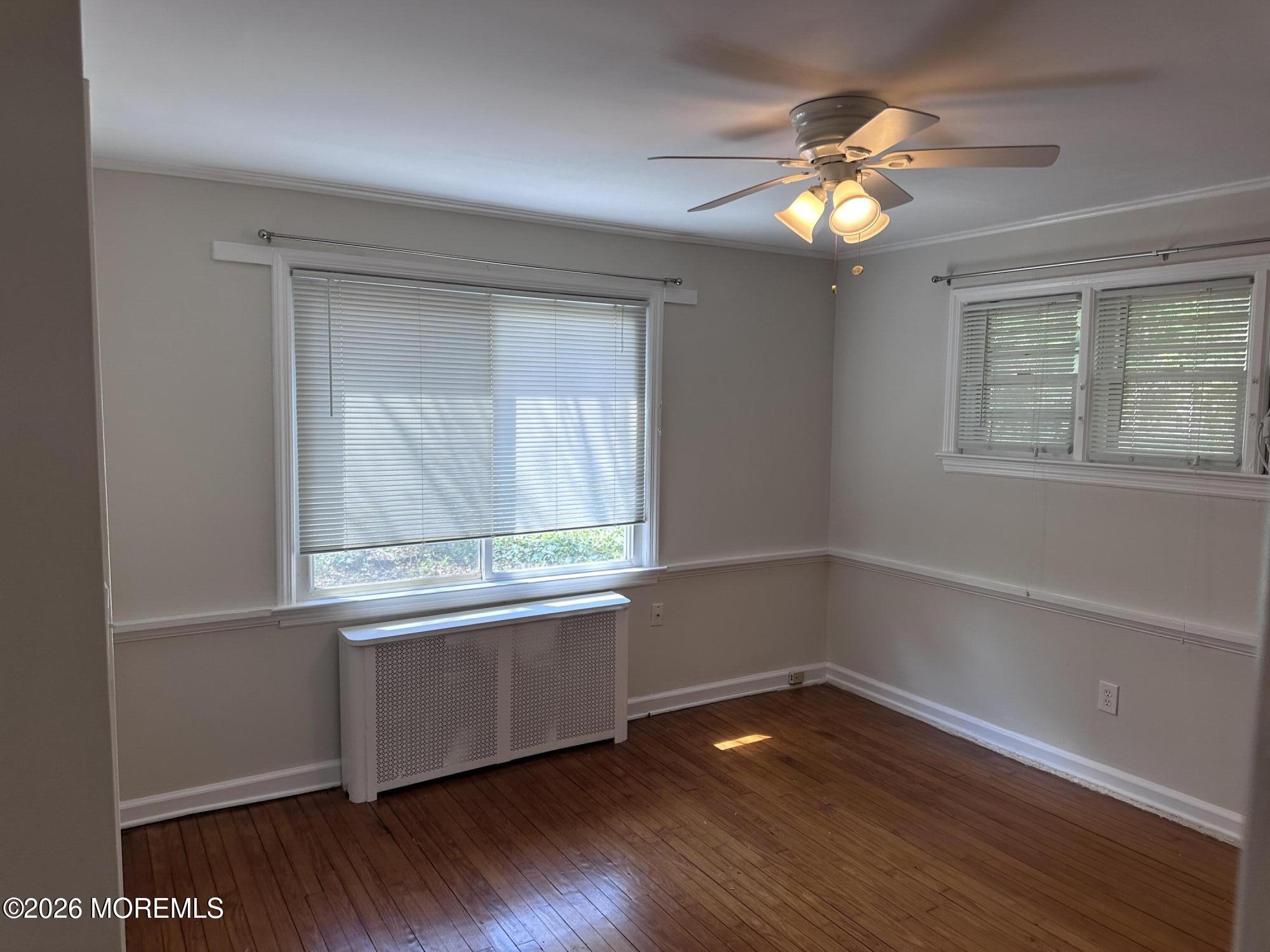 10 Ocean Street Highlands, NJ 07732 - Photo 9 of 15 a view of an empty room with wooden floor and a window