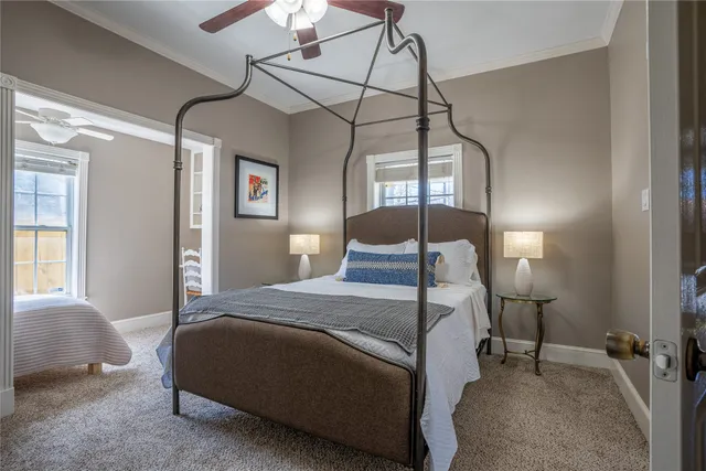 a bedroom with a bed and a lamp