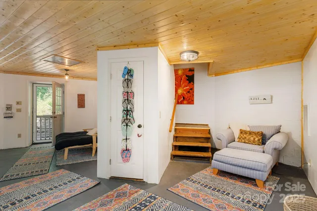 a bedroom with furniture and a rug