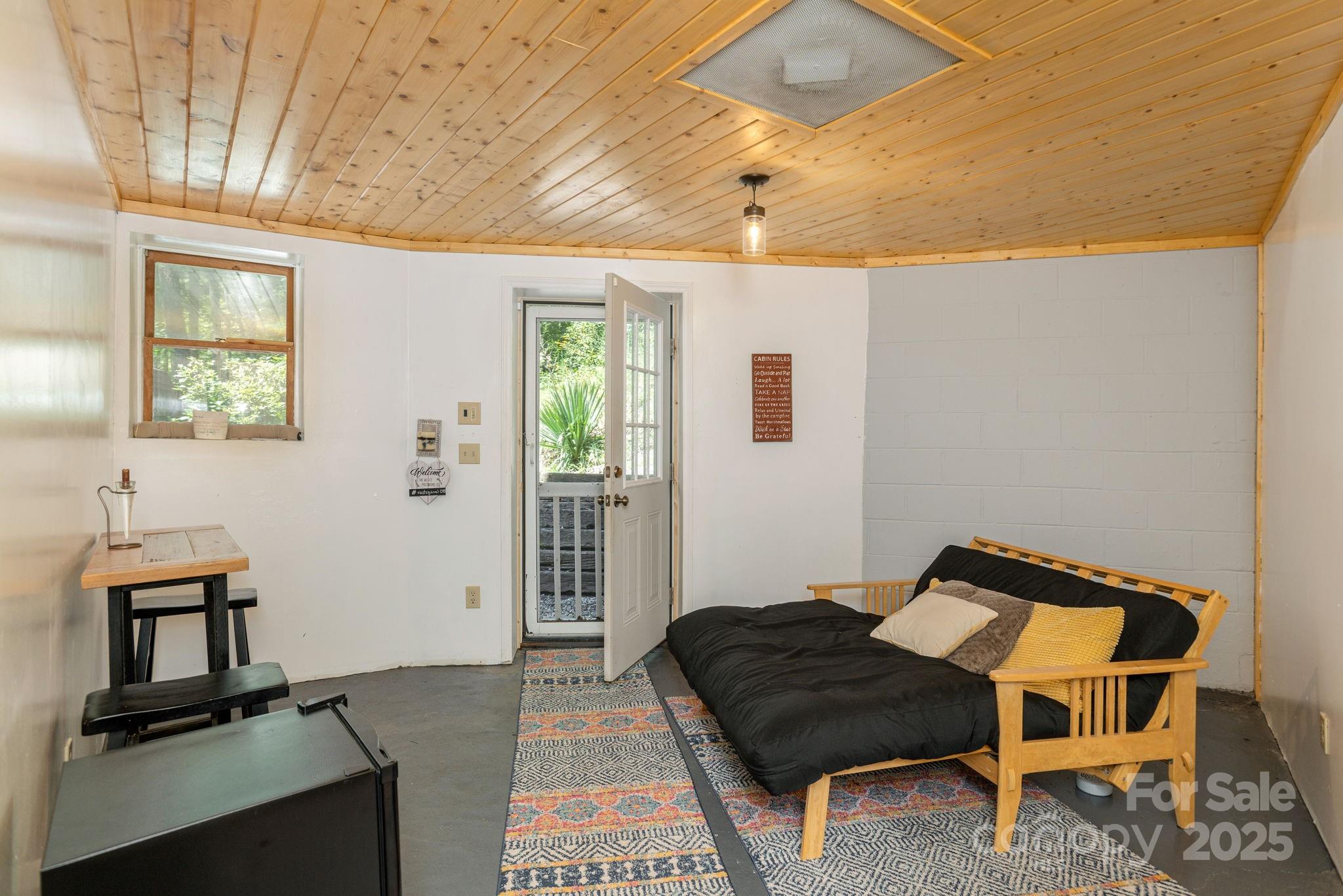 78 Bryant Road Swannanoa, NC 28778 - Photo 21 of 29 a living room with furniture and a window