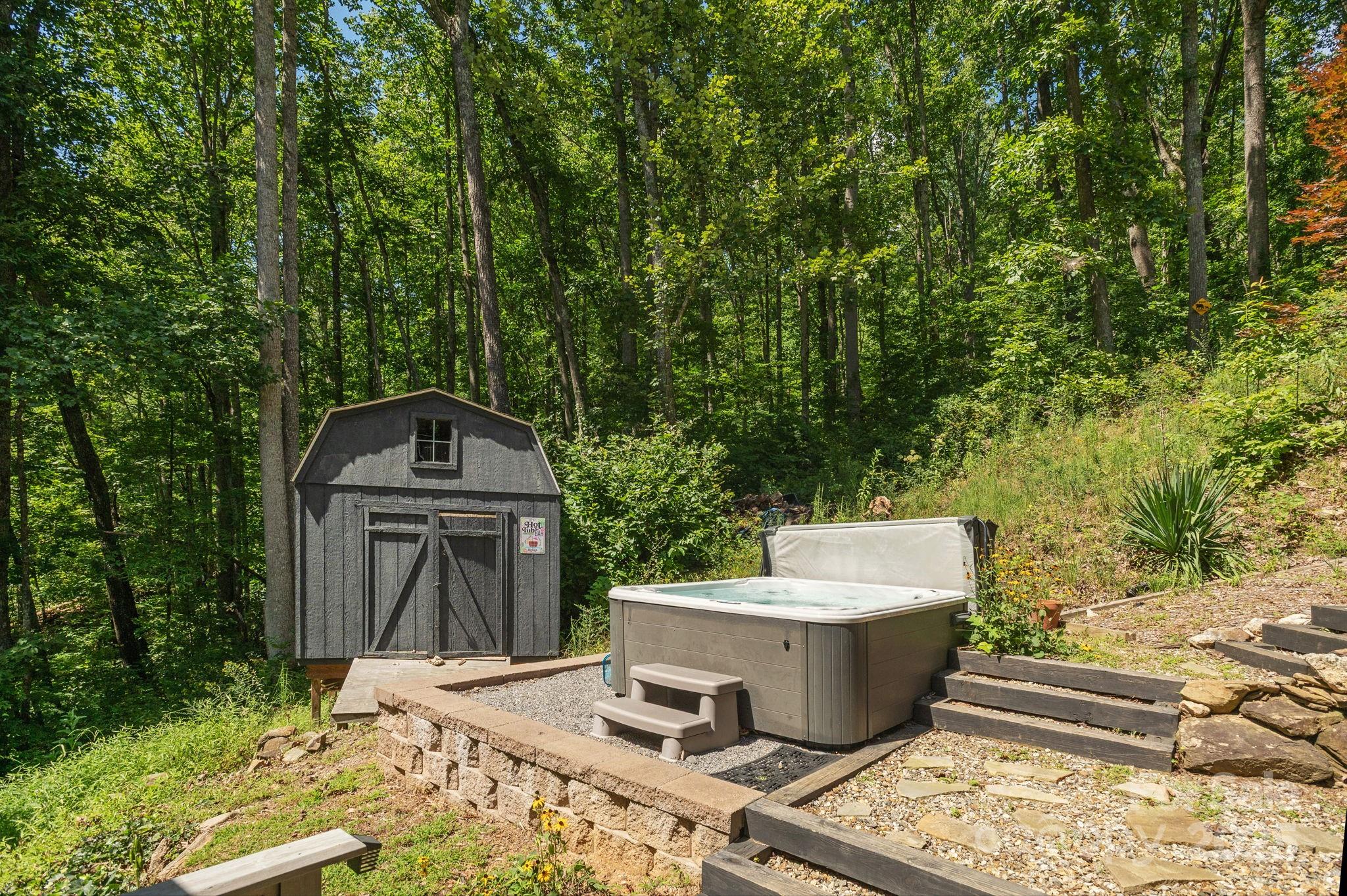 78 Bryant Road Swannanoa, NC 28778 - Photo 25 of 29 a view of a two chairs next to a yard
