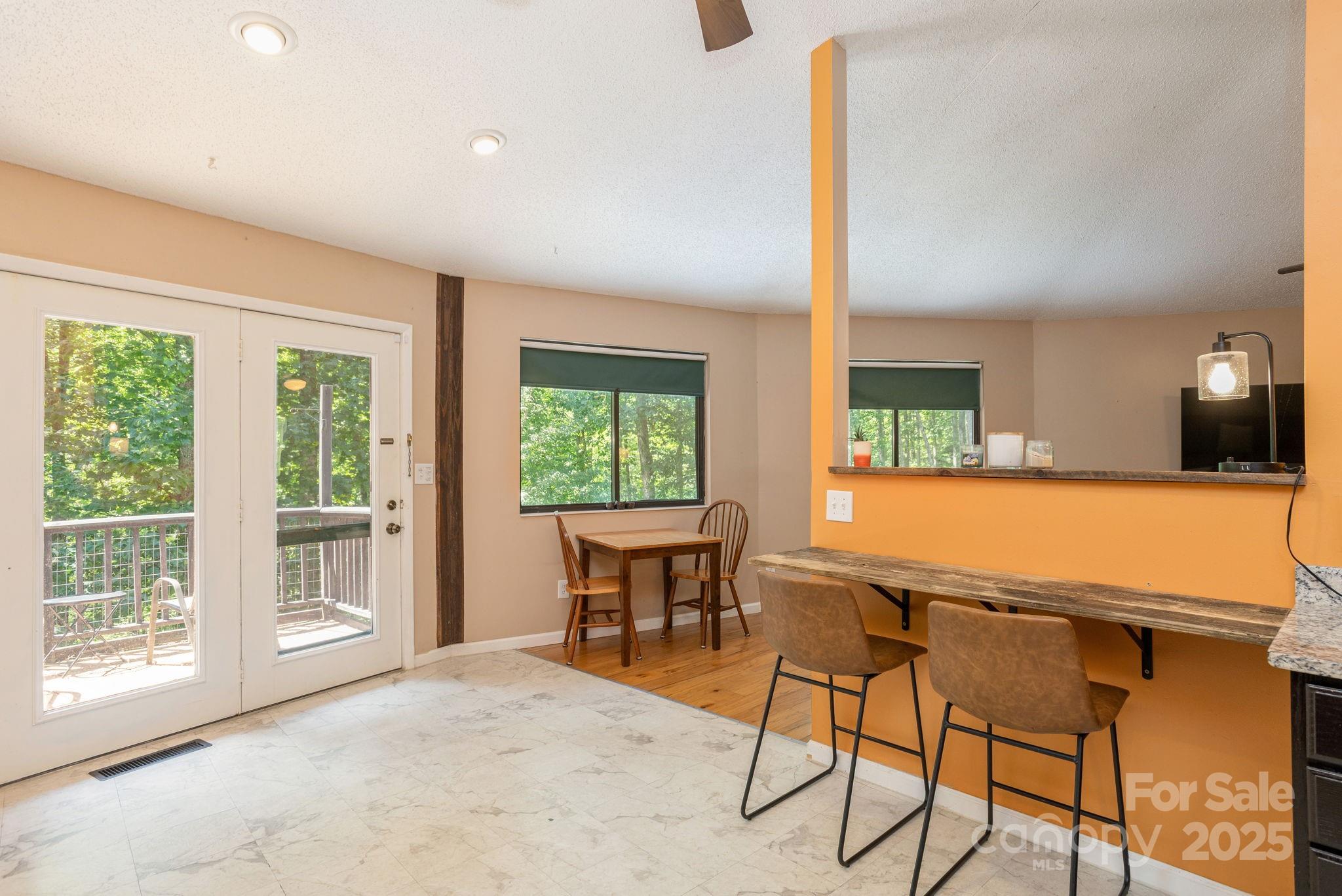 78 Bryant Road Swannanoa, NC 28778 - Photo 9 of 29 a view of a workspace with furniture and a window