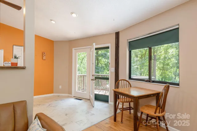 a view of a livingroom with furniture window and outside view