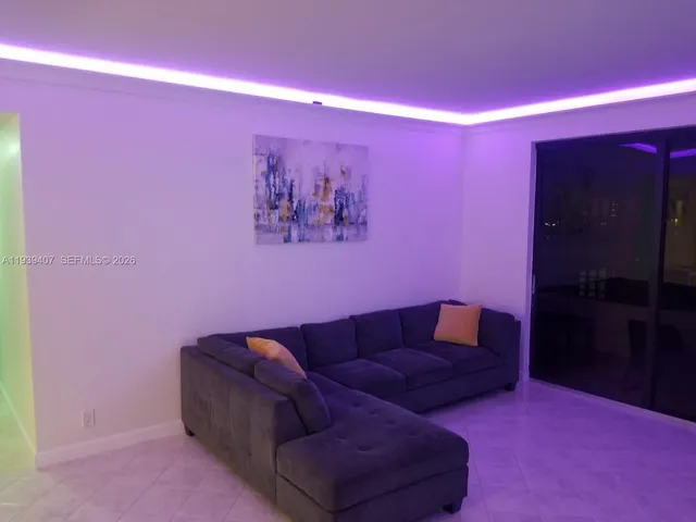 a view of kitchen with furniture and refrigerator