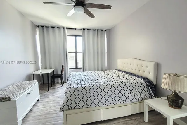 a view of a hallway with wooden shelves