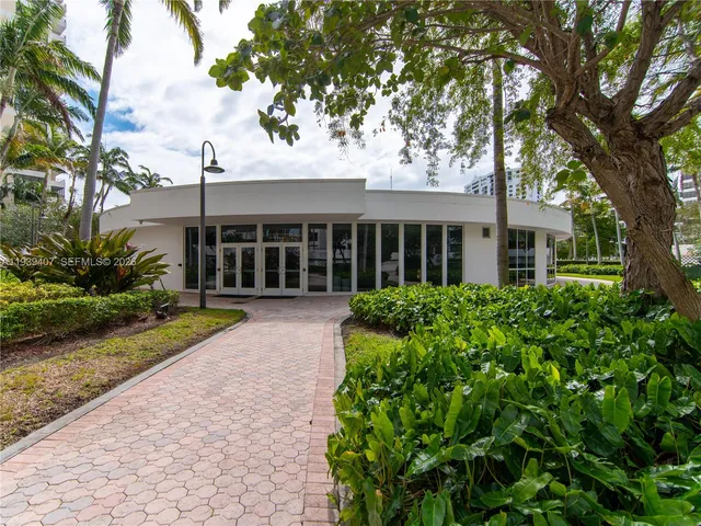 a view of swimming pool with outdoor seating and city view