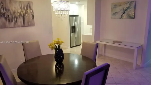 a large kitchen with stainless steel appliances a sink stove and cabinets