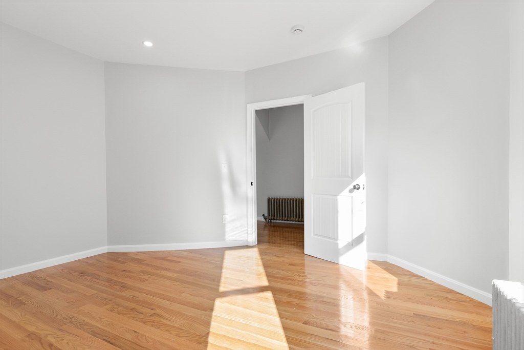 68 Middlebury Street Lawrence, MA 01841 - Photo 11 of 41 a view of an empty room with wooden floor