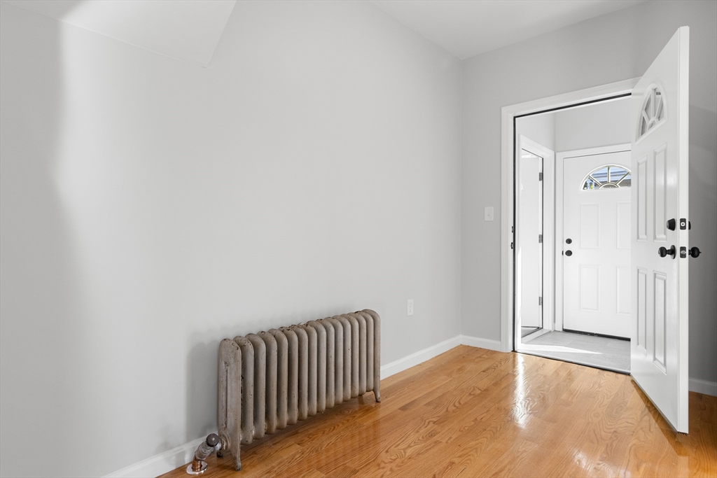 68 Middlebury Street Lawrence, MA 01841 - Photo 12 of 41 a view of a hallway with wooden floor and closet