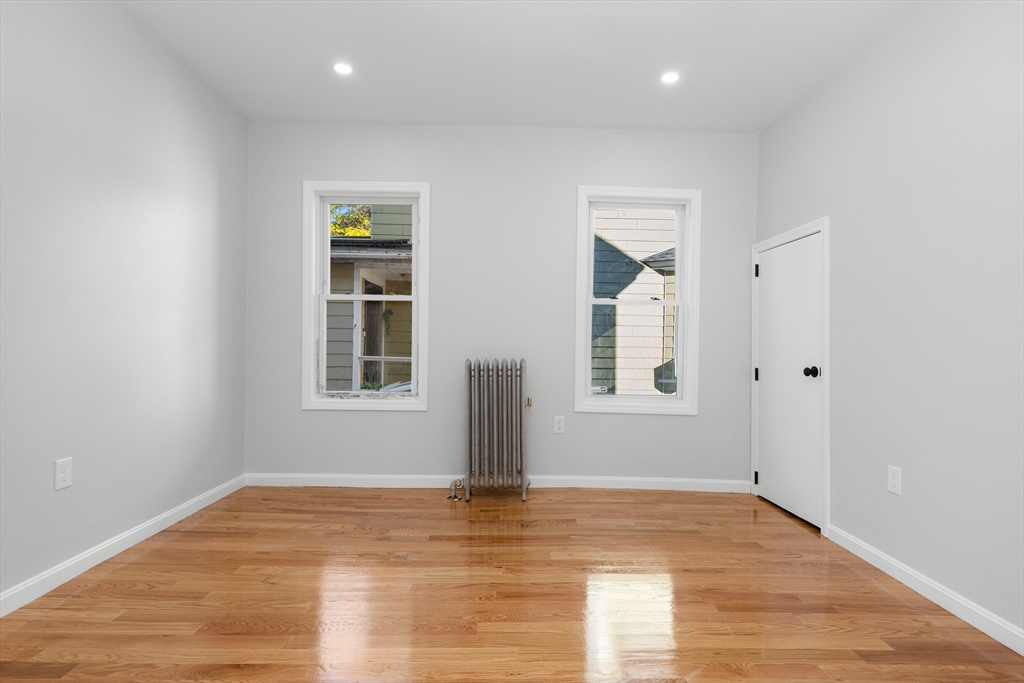 68 Middlebury Street Lawrence, MA 01841 - Photo 13 of 41 a view of empty room with wooden floor and fan