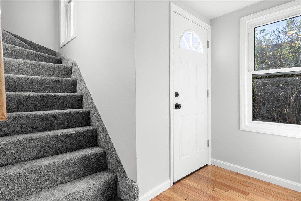 68 Middlebury Street Lawrence, MA 01841 - Photo 17 of 41 a view of entryway with wooden floor and stairs