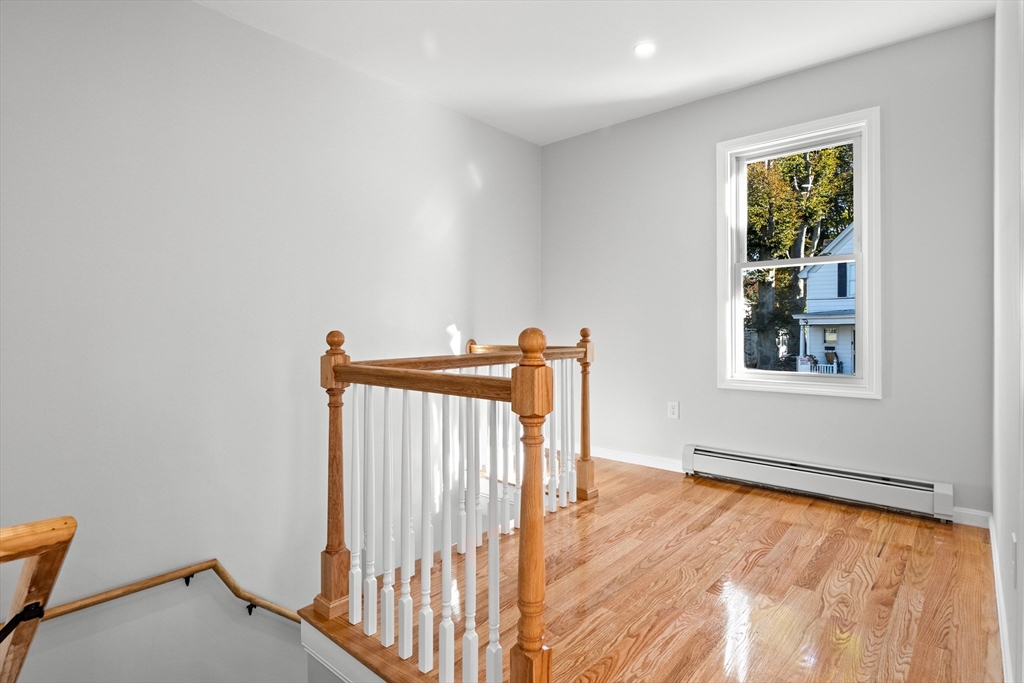 68 Middlebury Street Lawrence, MA 01841 - Photo 18 of 41 a view of an empty room with wooden floor and a window