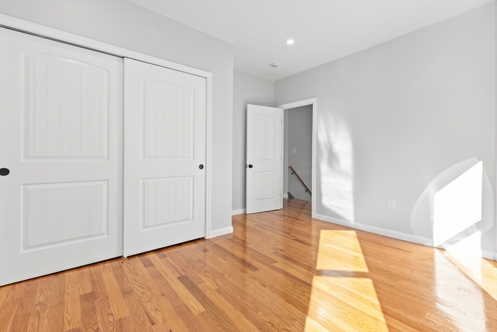 68 Middlebury Street Lawrence, MA 01841 - Photo 20 of 41 a view of an empty room with wooden floor