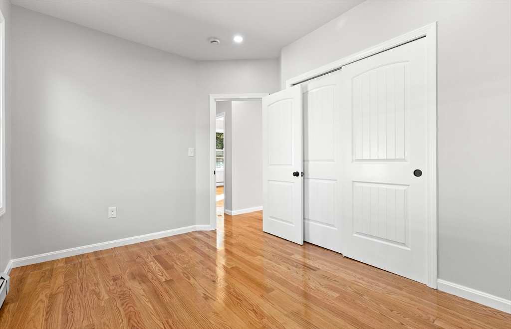 68 Middlebury Street Lawrence, MA 01841 - Photo 22 of 41 a view of empty room with wooden floor
