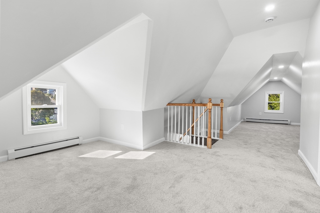 68 Middlebury Street Lawrence, MA 01841 - Photo 31 of 41 an empty room with a chandeliers fan