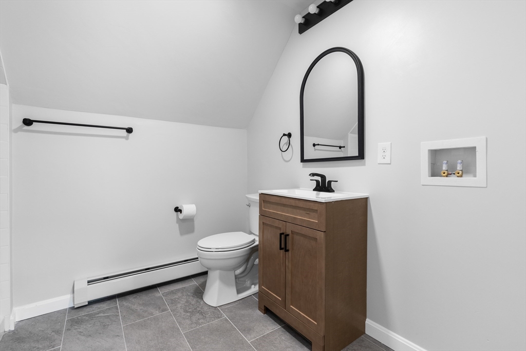 68 Middlebury Street Lawrence, MA 01841 - Photo 33 of 41 a bathroom with a sink a toilet and a mirror