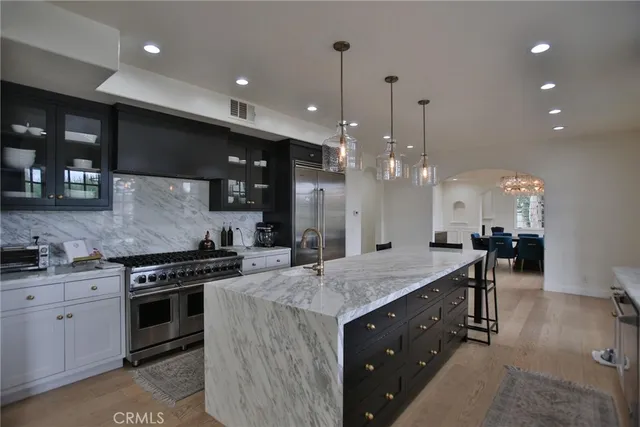 a dining room with furniture a chandelier and window