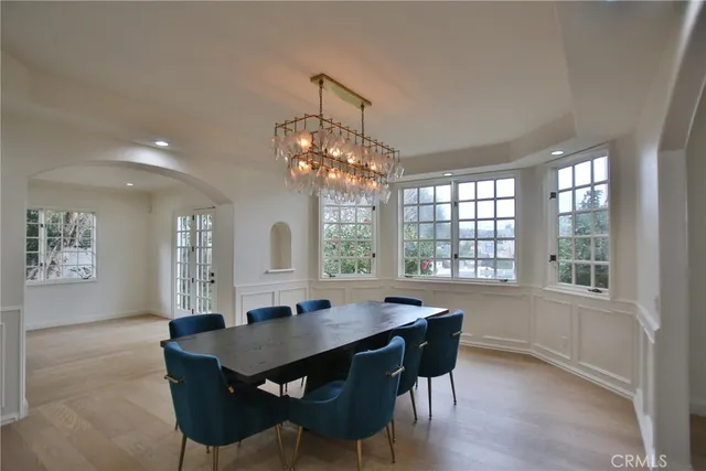 a bathroom with a sink mirror and toilet