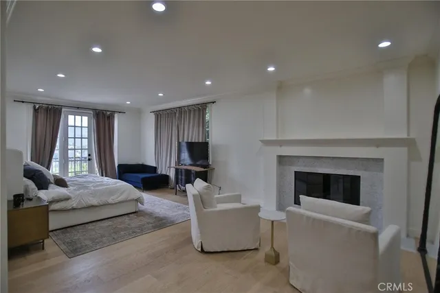 a spacious bathroom with a double vanity sink a large mirror and a bathtub