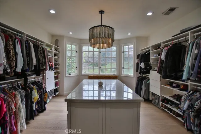 a view of a workspace with a window and lounge chair