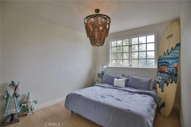 a bathroom with a granite countertop sink toilet a mirror and shower
