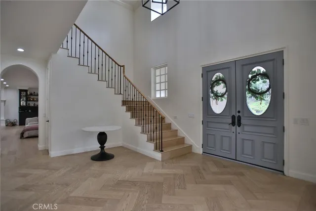 a view of an entryway with wooden floor
