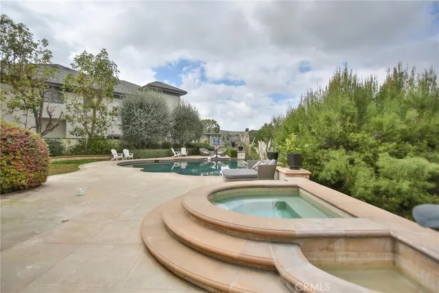 a view of a house with a yard and entertaining space