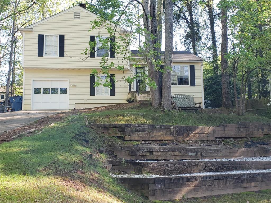 79 Birch Rill Drive Alpharetta, GA 30022 - Photo 1 of 1 a front view of a house with garden