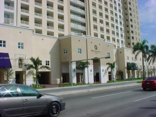 117 Northwest 42nd Avenue, Unit 800 Miami, FL 33126 - Photo 1 of 13 a view of a building and car parked