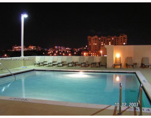 117 Northwest 42nd Avenue, Unit 800 Miami, FL 33126 - Photo 11 of 13 a view of a swimming pool and outdoor seating