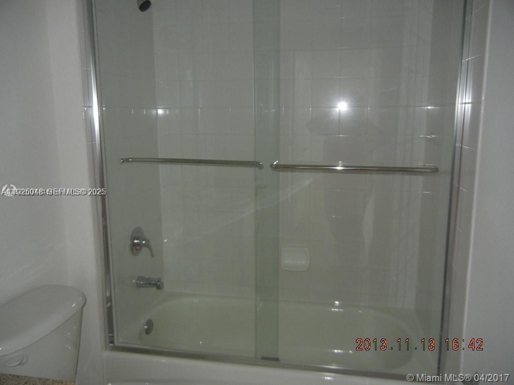 117 Northwest 42nd Avenue, Unit 800 Miami, FL 33126 - Photo 9 of 13 a bathroom with a shower