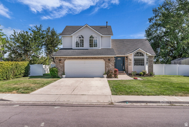 1147 West State Road Lehi, UT 84043 - Photo 1 of 31 Two-story residence featuring light gray siding and a dark shingle roof