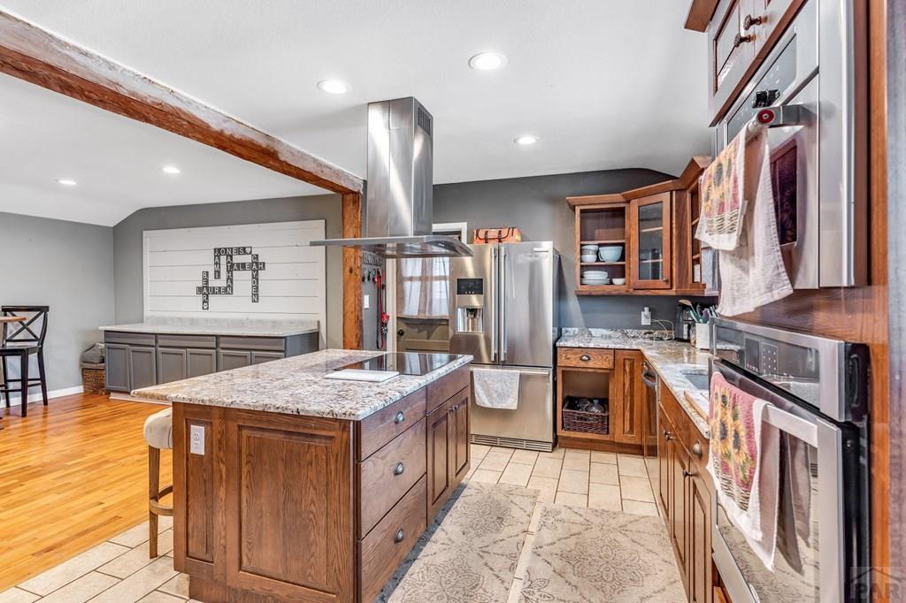 6597 County Lane 14 Ordway, CO 81063 - Photo 12 of 66 a open kitchen with stainless steel appliances granite countertop a sink and a refrigerator
