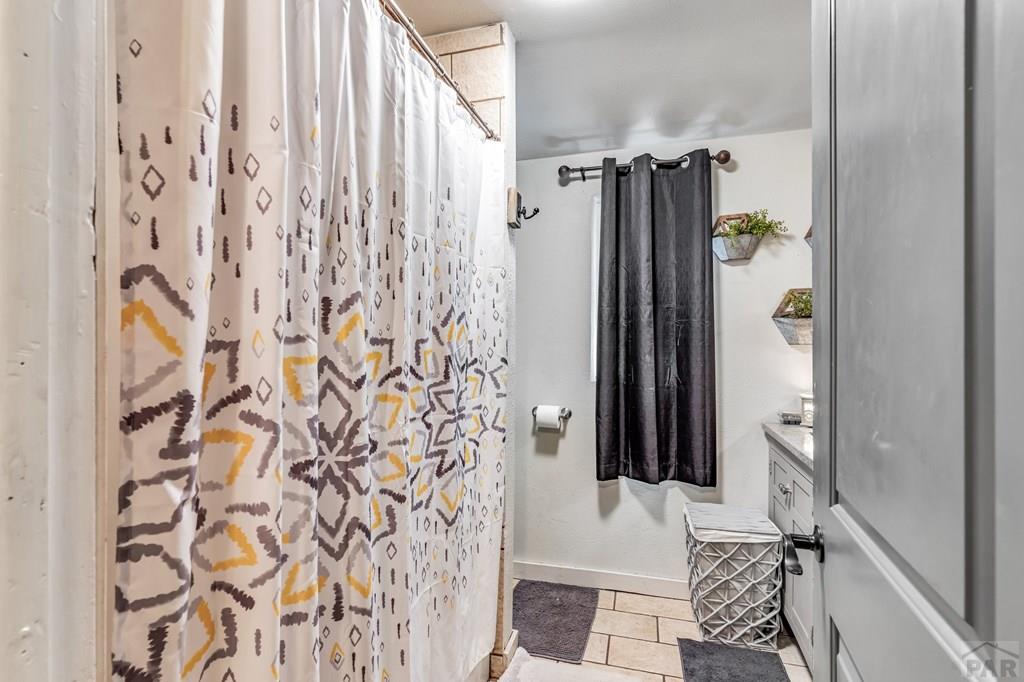 6597 County Lane 14 Ordway, CO 81063 - Photo 16 of 66 a bathroom with a shower and a tub