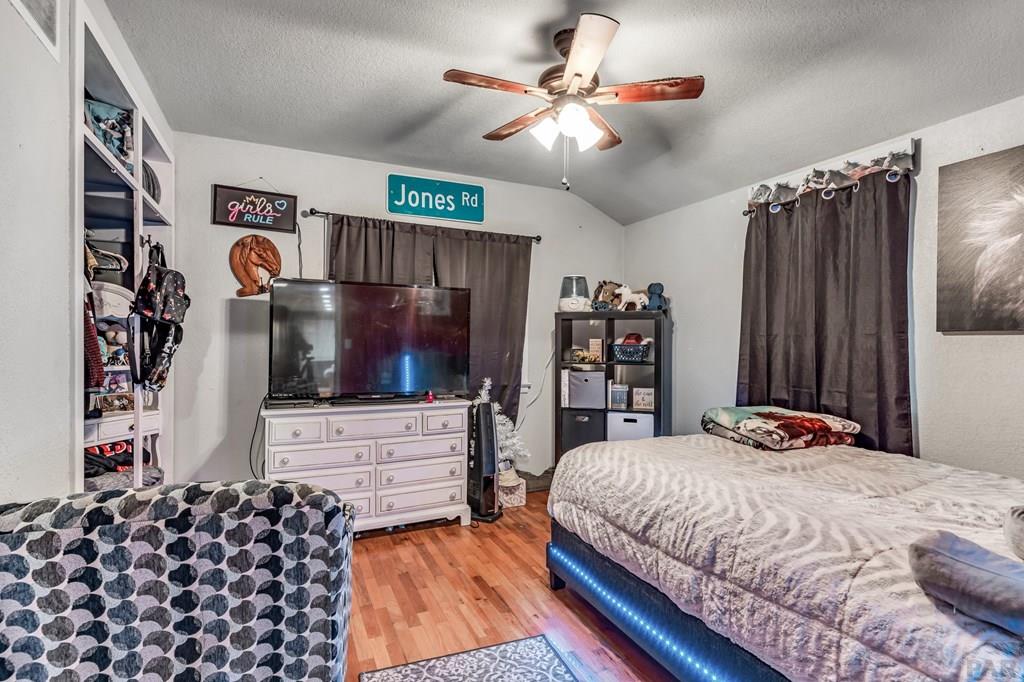 6597 County Lane 14 Ordway, CO 81063 - Photo 18 of 66 a bedroom with a bed and a flat screen tv
