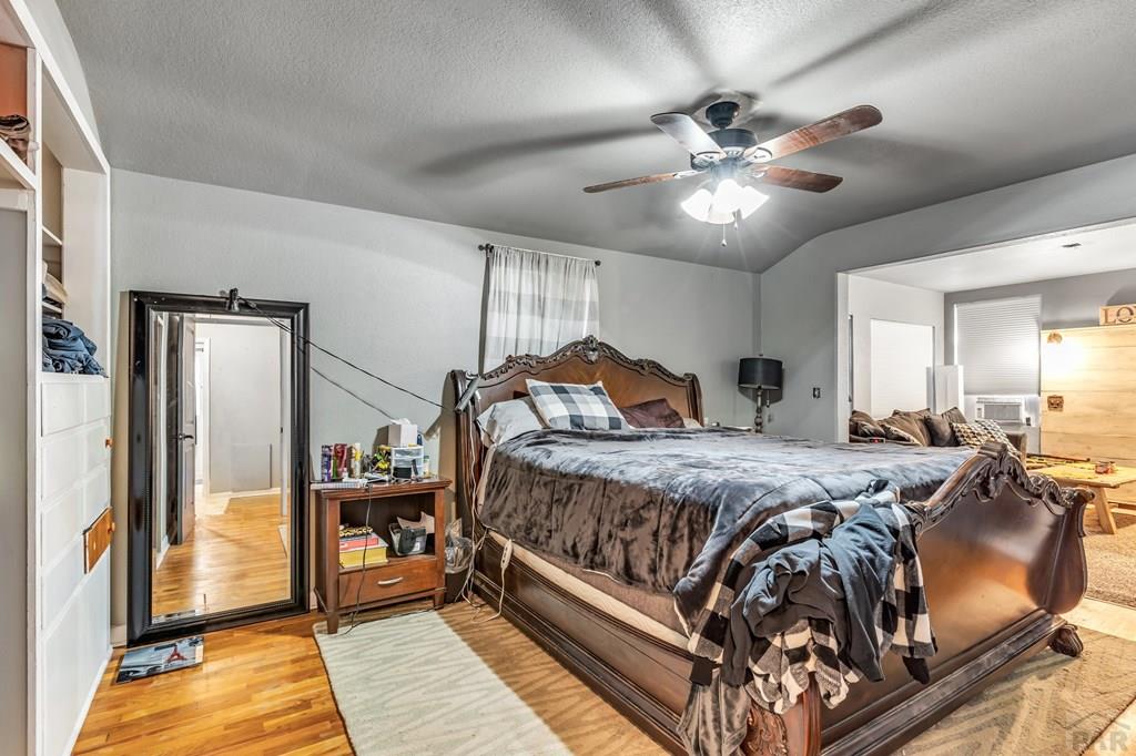 6597 County Lane 14 Ordway, CO 81063 - Photo 19 of 66 a bedroom with a bed and ceiling fan